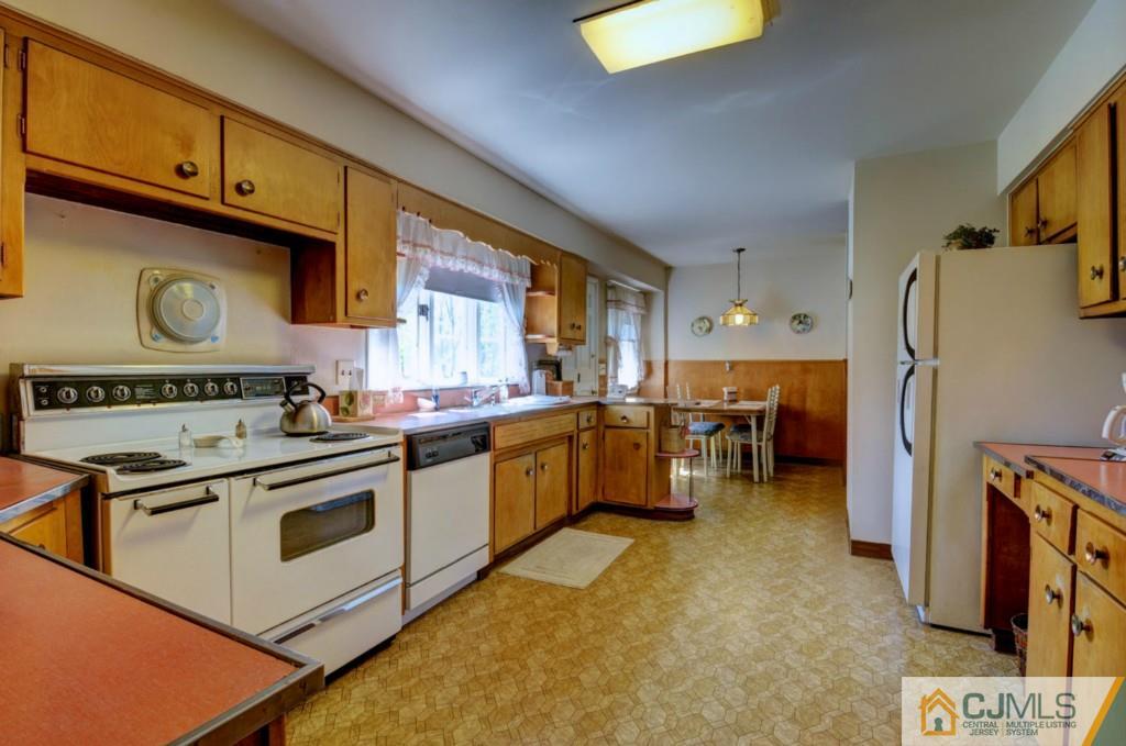 11 Stafford Road Colonia, NJ 07067 - Photo 8 of 25 a kitchen with a sink appliances and cabinets