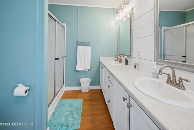 a bathroom with a tub and shower