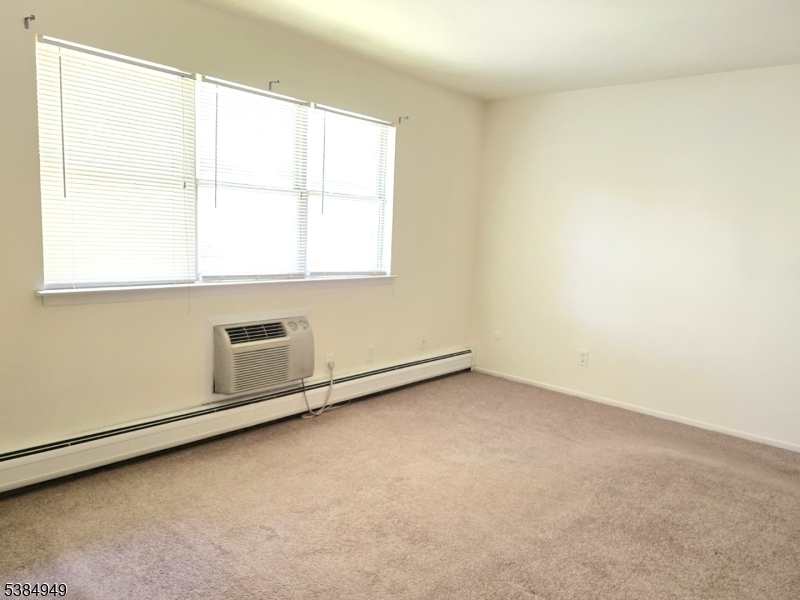 1041 Ridge Street, Unit A6 Phillipsburg, NJ 08865 - Photo 5 of 19 an empty room with a window