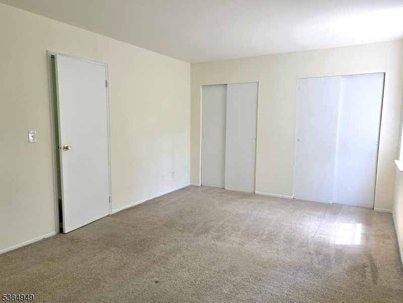 1041 Ridge Street, Unit A6 Phillipsburg, NJ 08865 - Photo 7 of 19 an empty room with windows and closet