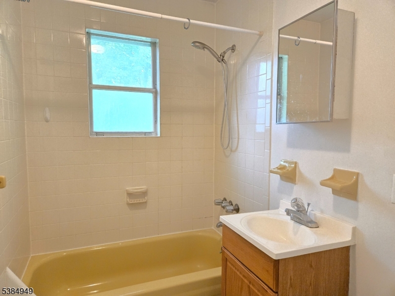 1041 Ridge Street, Unit A6 Phillipsburg, NJ 08865 - Photo 8 of 19 a bathroom with a sink a toilet and shower