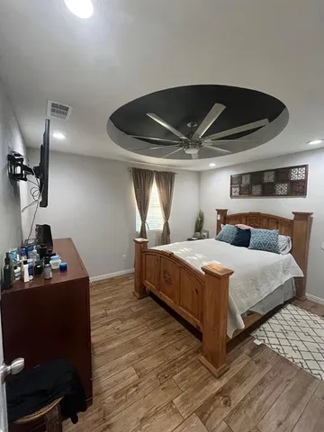 a bedroom with bed and window