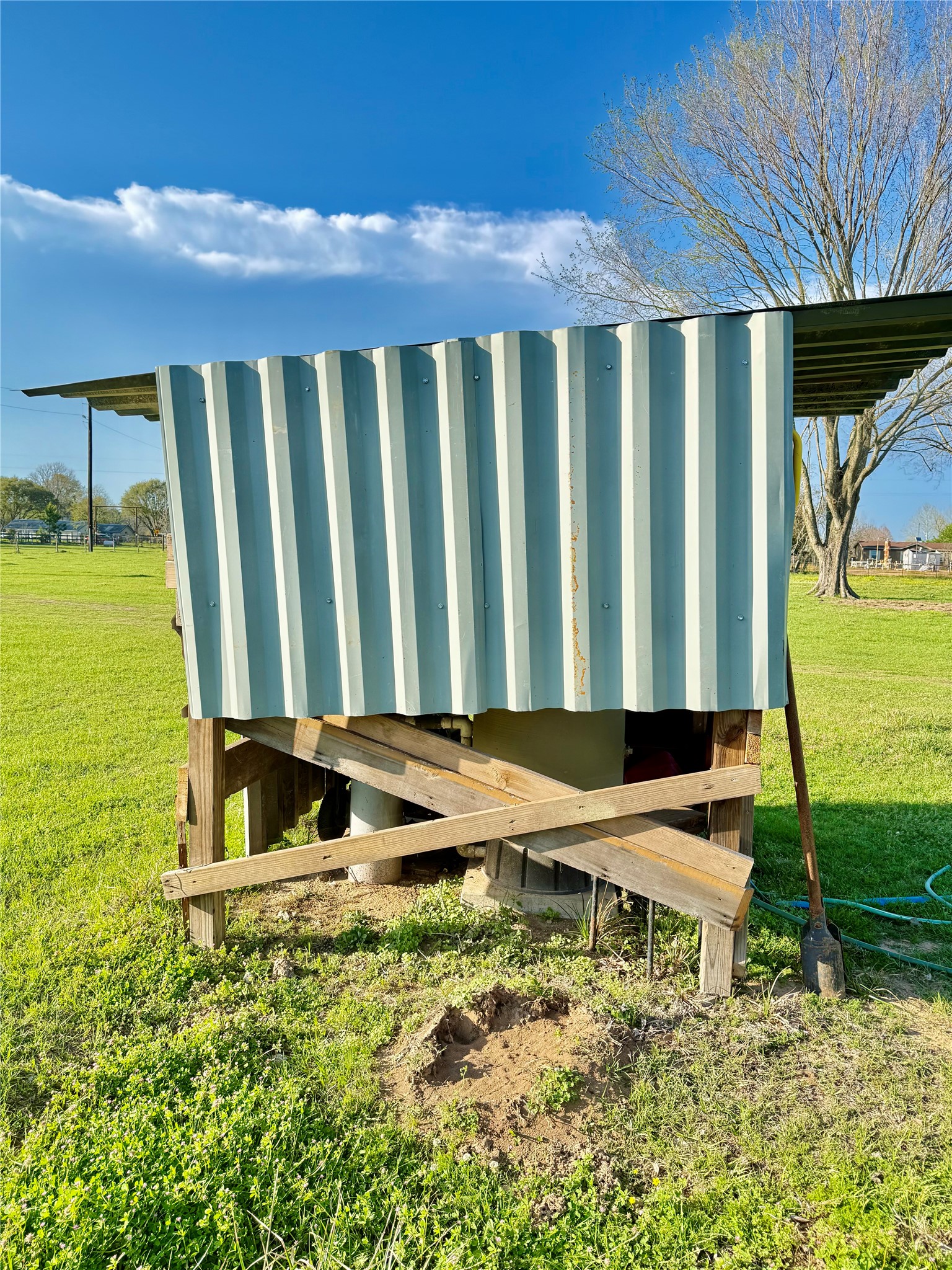 29921 Waller Spring Creek Road Waller, TX 77484 - Photo 12 of 23 a backyard of a house with table and chairs