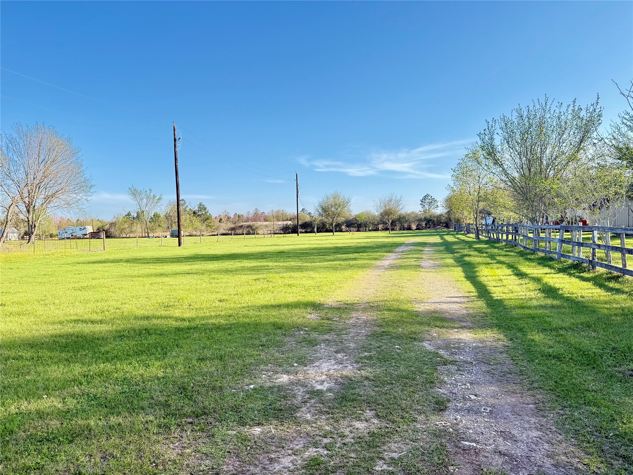 29921 Waller Spring Creek Road Waller, TX 77484 - Photo 2 of 23 a view of a swimming pool with an outdoor space and seating area