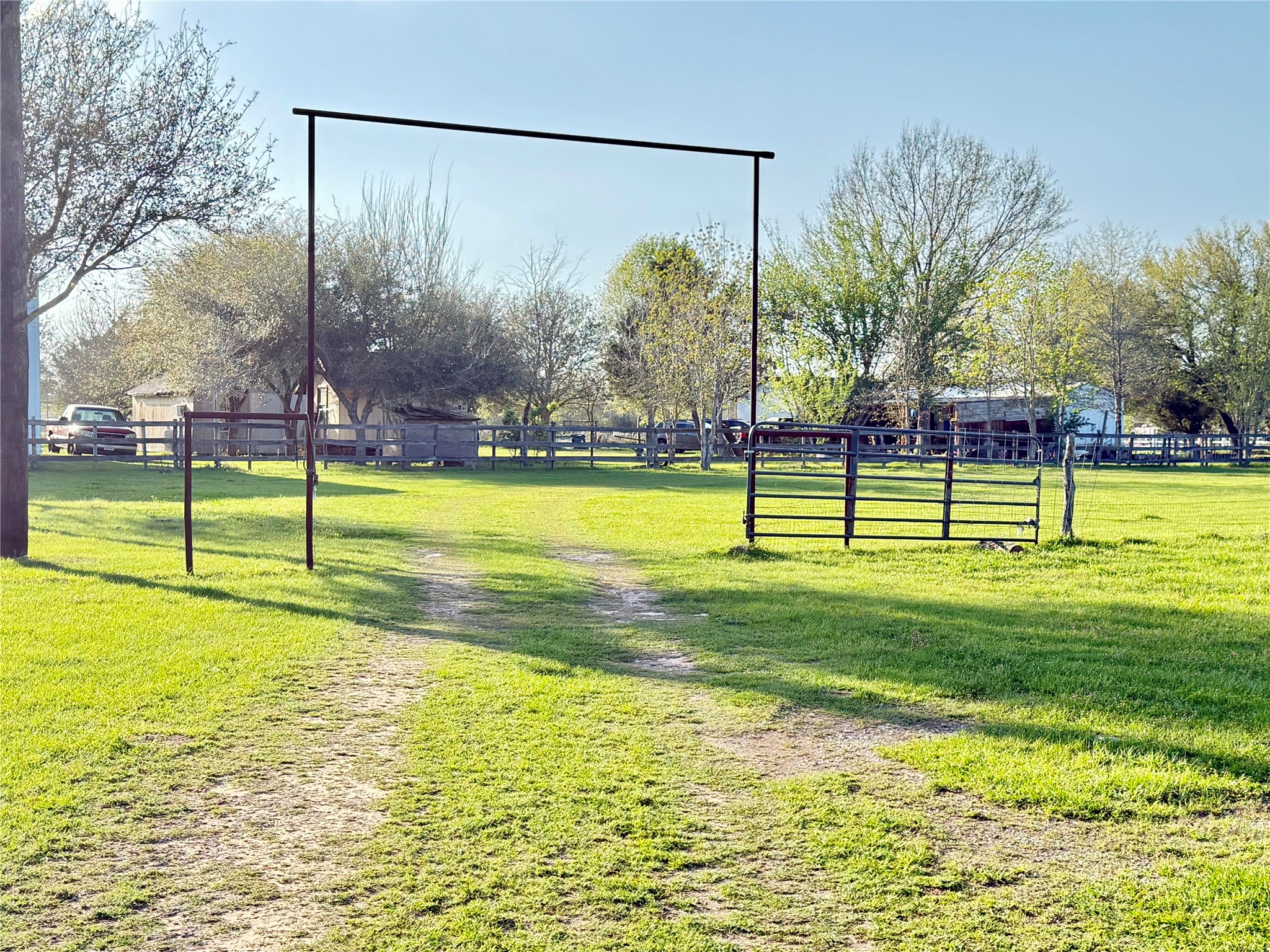 29921 Waller Spring Creek Road Waller, TX 77484 - Photo 23 of 23 a view of a swimming pool with a garden and trees