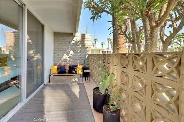 a living room filled with furniture and a chandelier