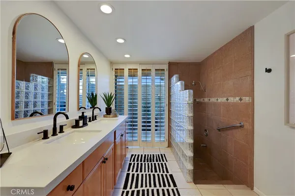 a view of a bathroom with a bathtub and a shower