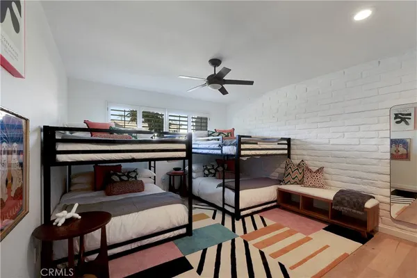 a bedroom with furniture and a chandelier