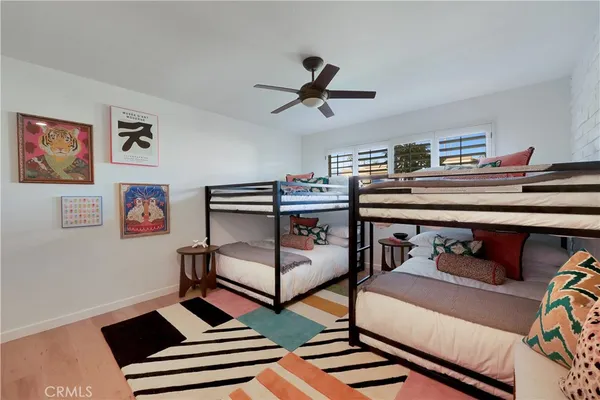 a bedroom with furniture and a baby crib