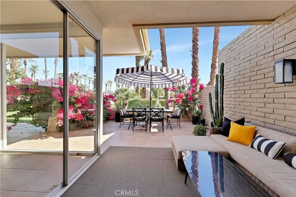 a view of a chairs and tables in patio