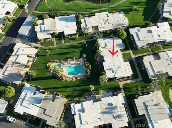 an aerial view of multiple houses with outdoor space