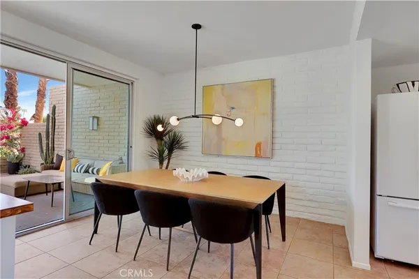 a view of a dining room with furniture and window