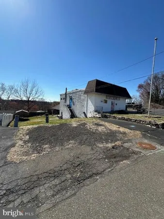a view of a car parked in front of a house