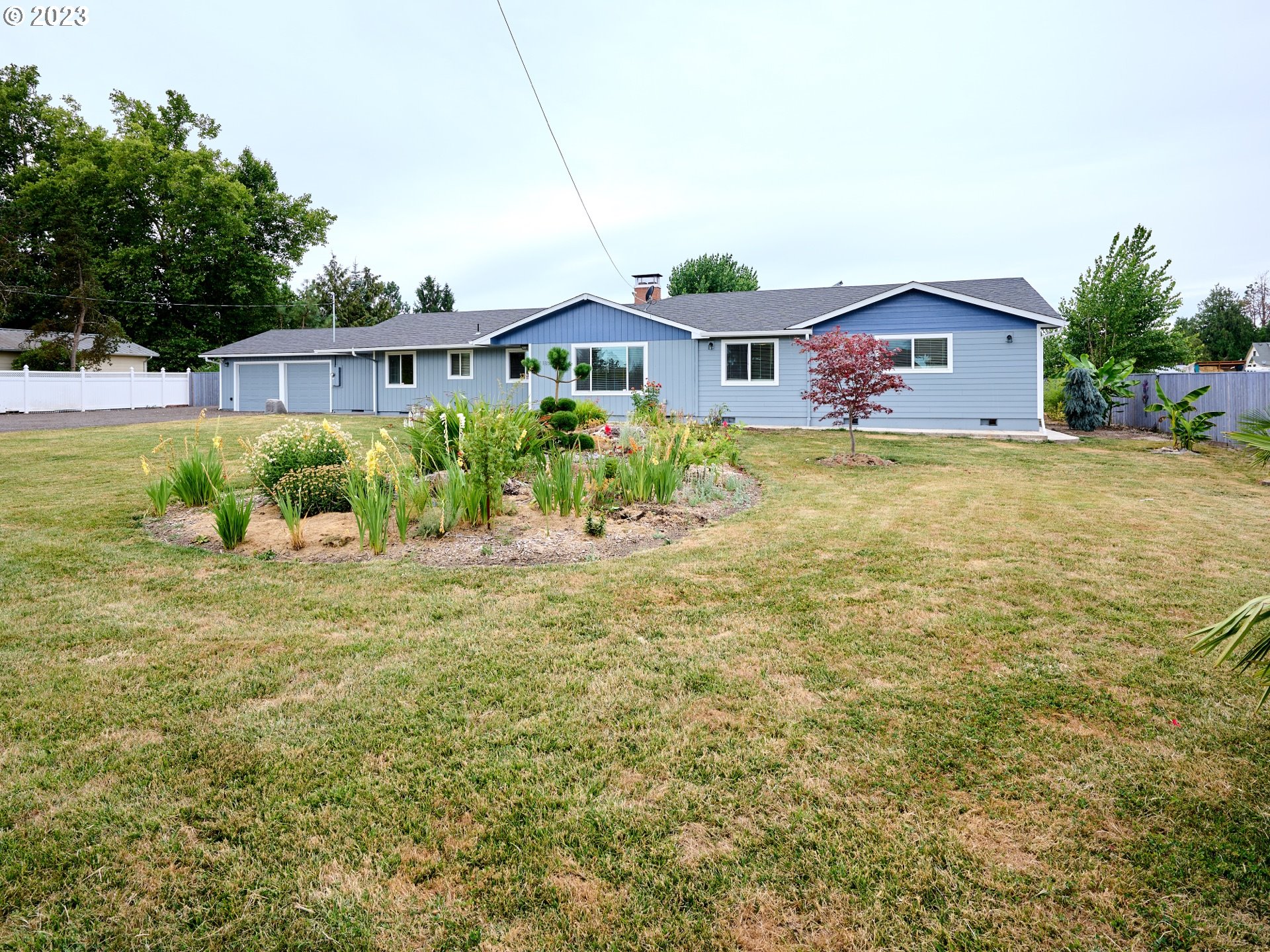 1185 Cordon Road Northeast Salem, OR 97317 - Photo 2 of 15 a front view of house with yard and trees