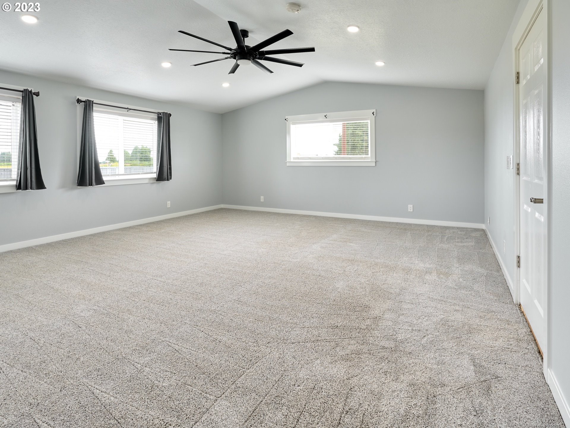 1185 Cordon Road Northeast Salem, OR 97317 - Photo 6 of 15 an empty room with windows and fan
