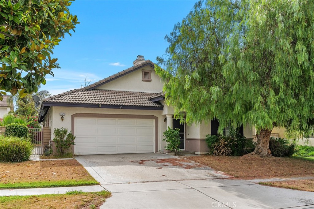 9523 Sunglow Court Rancho Cucamonga, CA 91730 - Photo 1 of 1 a front view of a house with a yard and garage