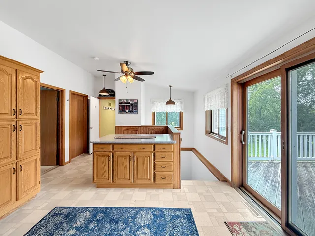 a large room with lots of wooden furniture and a bath tub