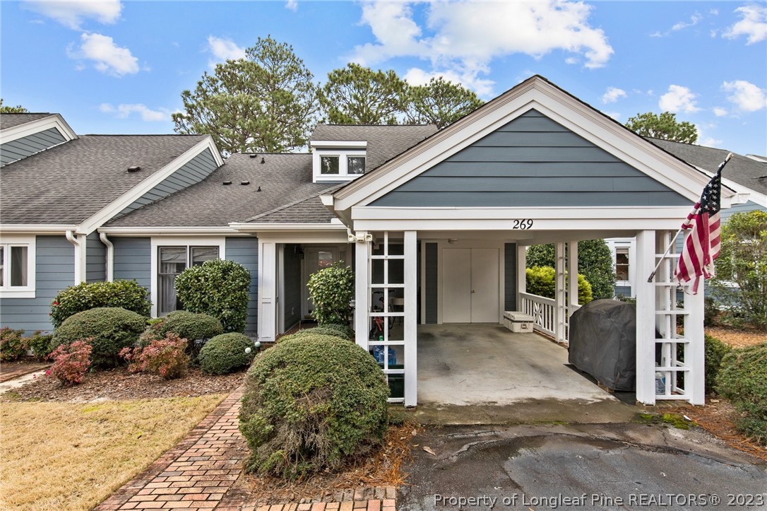269 Knoll Road, Unit 409 Southern Pines, NC 28387 - Photo 1 of 40 front view of a house with a yard