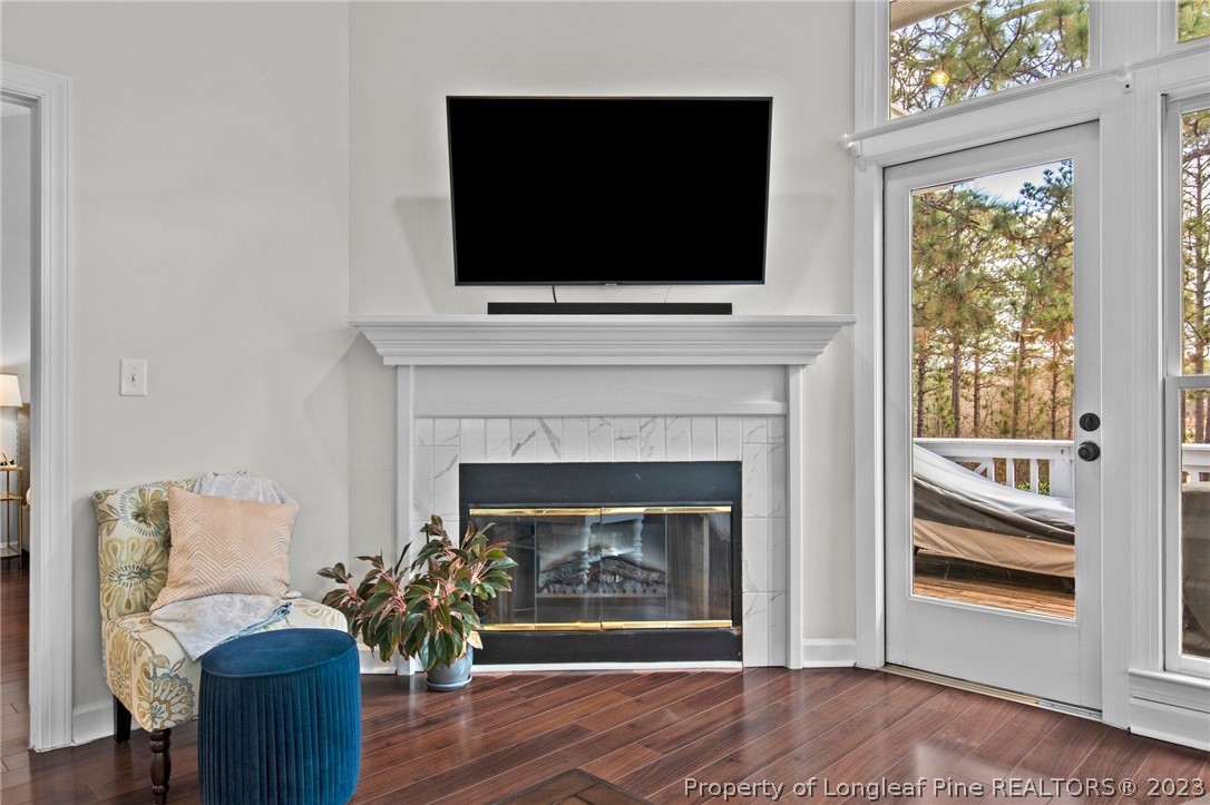 269 Knoll Road, Unit 409 Southern Pines, NC 28387 - Photo 14 of 40 a living room with furniture and a fireplace
