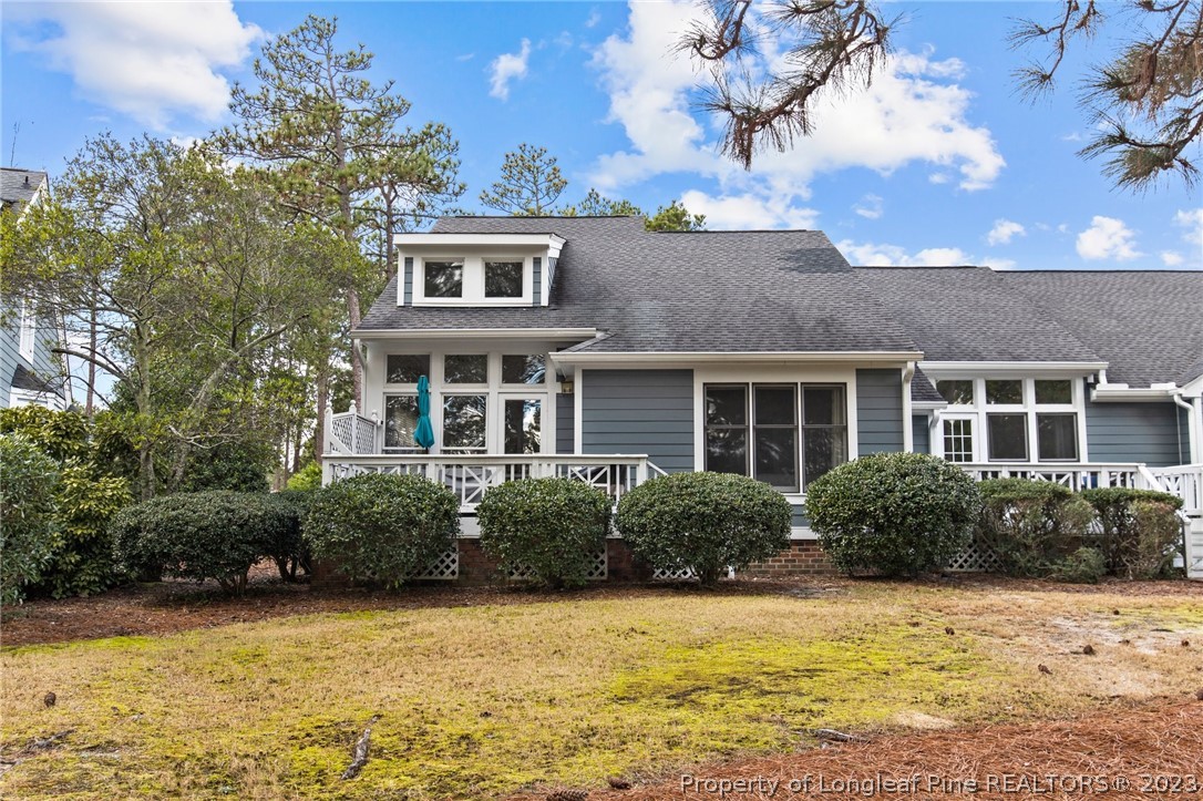 269 Knoll Road, Unit 409 Southern Pines, NC 28387 - Photo 2 of 40 a front view of a house with a yard