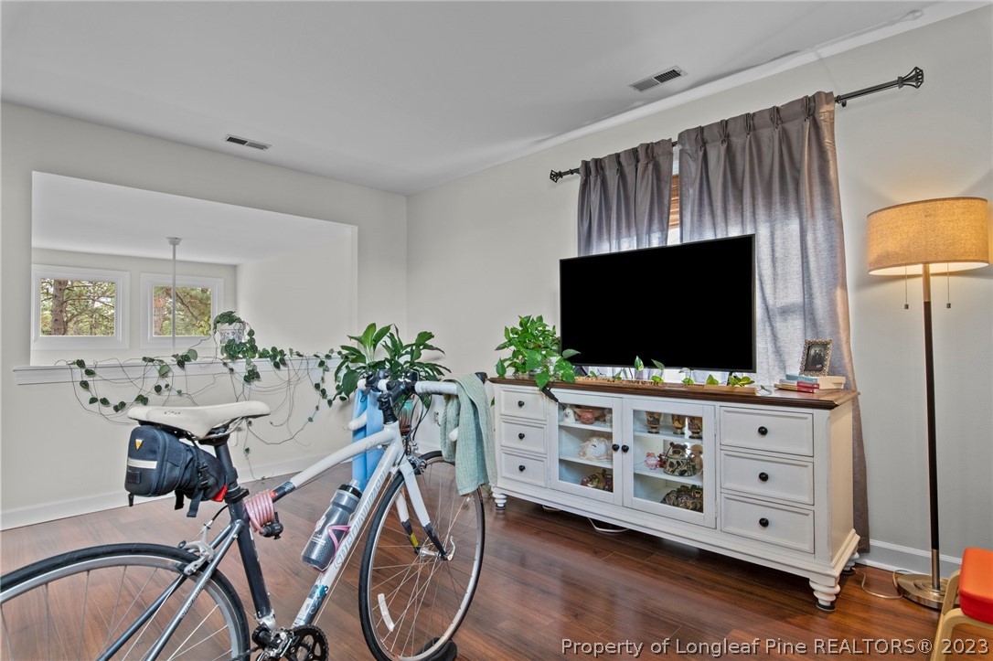 269 Knoll Road, Unit 409 Southern Pines, NC 28387 - Photo 25 of 40 a living room with furniture and a flat screen tv