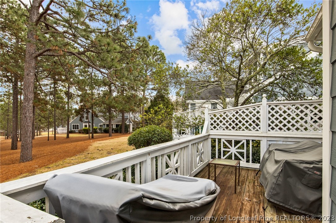 269 Knoll Road, Unit 409 Southern Pines, NC 28387 - Photo 34 of 40 a view of deck with furniture and trees
