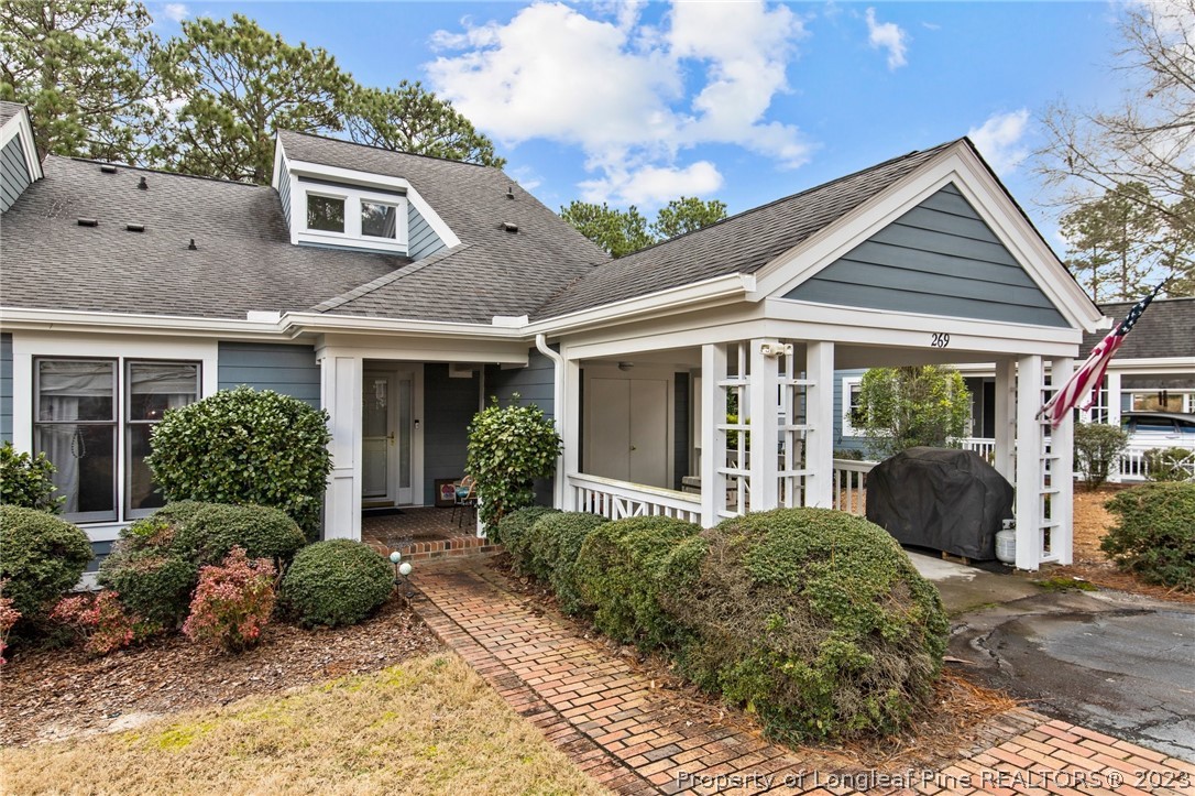 269 Knoll Road, Unit 409 Southern Pines, NC 28387 - Photo 36 of 40 a view of a house with backyard and garden