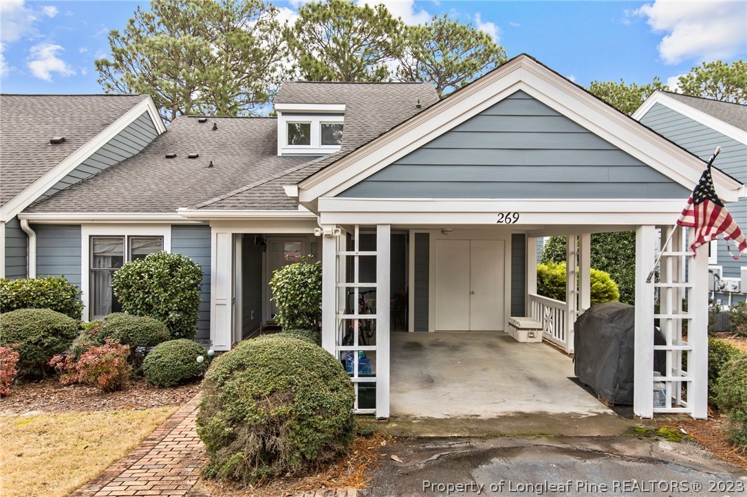 269 Knoll Road, Unit 409 Southern Pines, NC 28387 - Photo 40 of 40 front view of a house with a yard
