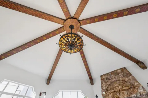 a spacious bedroom with a large bed and a window