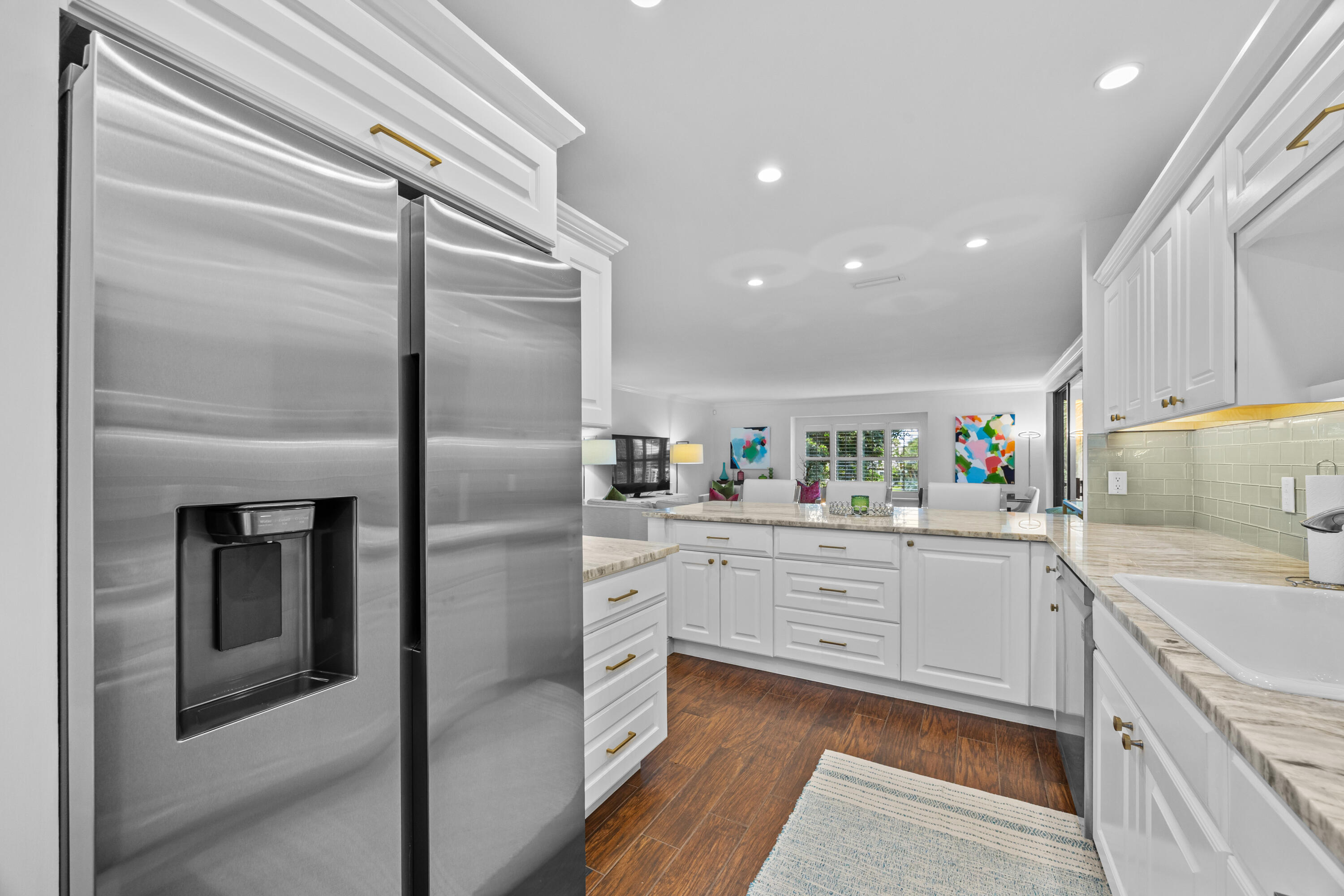 13254 Polo Club Road, Unit C204 Wellington, FL 33414 - Photo 9 of 29 a kitchen with cabinets stainless steel appliances and a window