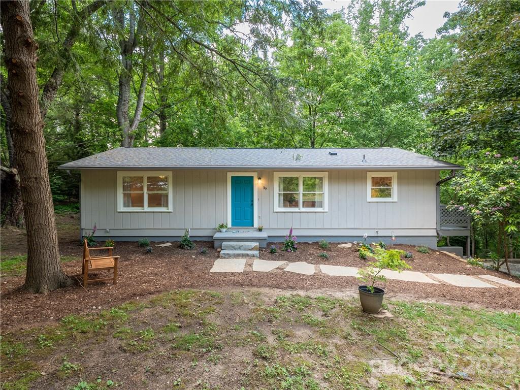 39 Cedar Mountain Road Asheville, NC 28803 - Photo 1 of 35 a view of a house with swimming pool in front of it