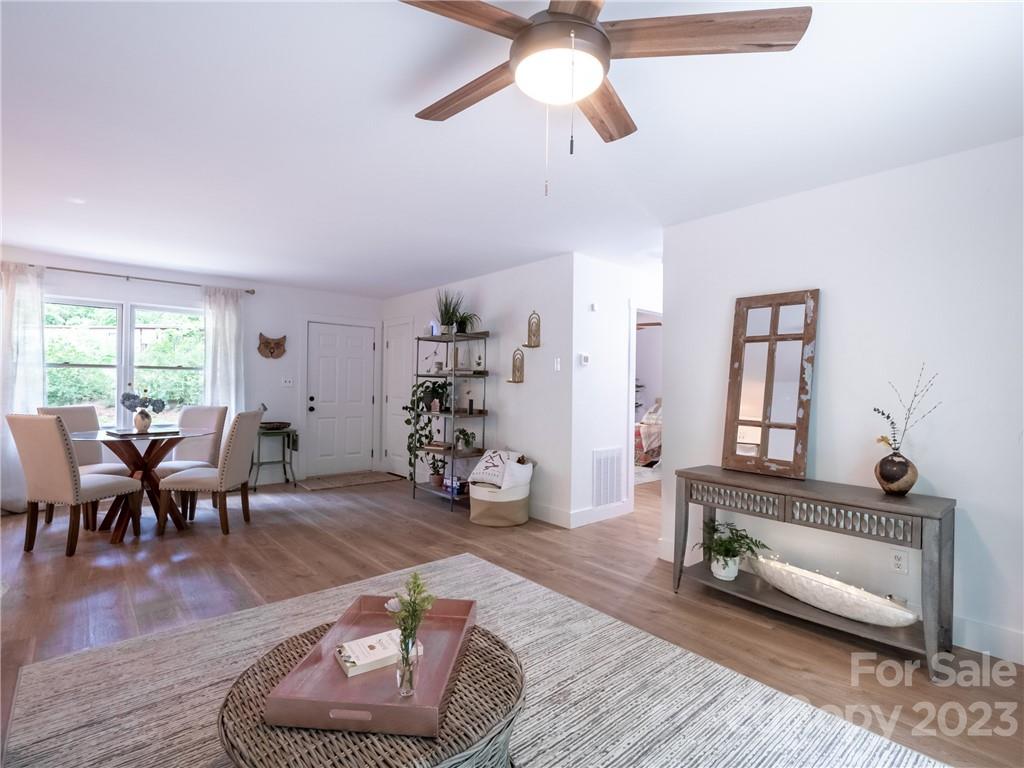39 Cedar Mountain Road Asheville, NC 28803 - Photo 11 of 35 a living room with furniture or couch and a window