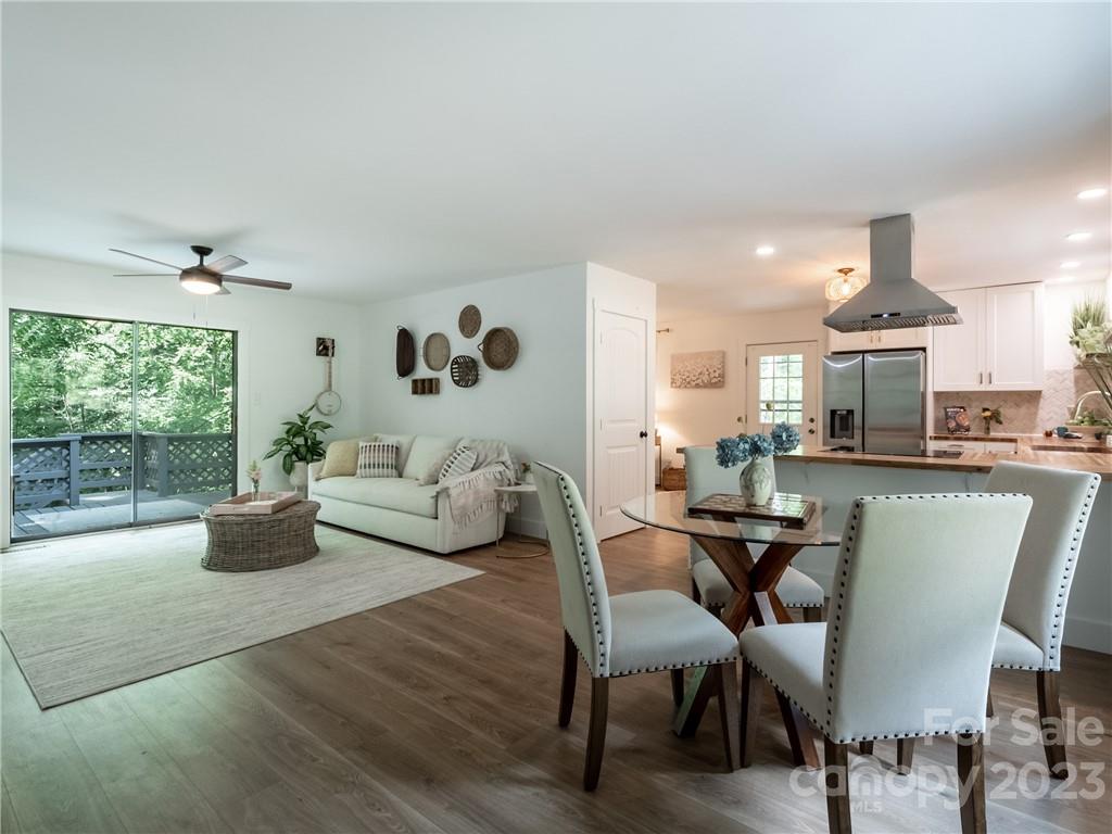 39 Cedar Mountain Road Asheville, NC 28803 - Photo 12 of 35 a living room with furniture and a large window