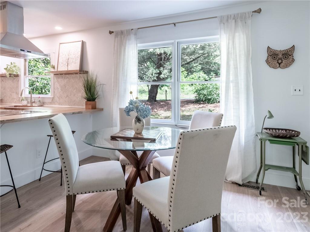 39 Cedar Mountain Road Asheville, NC 28803 - Photo 13 of 35 a view of a dining room with furniture window and outside view