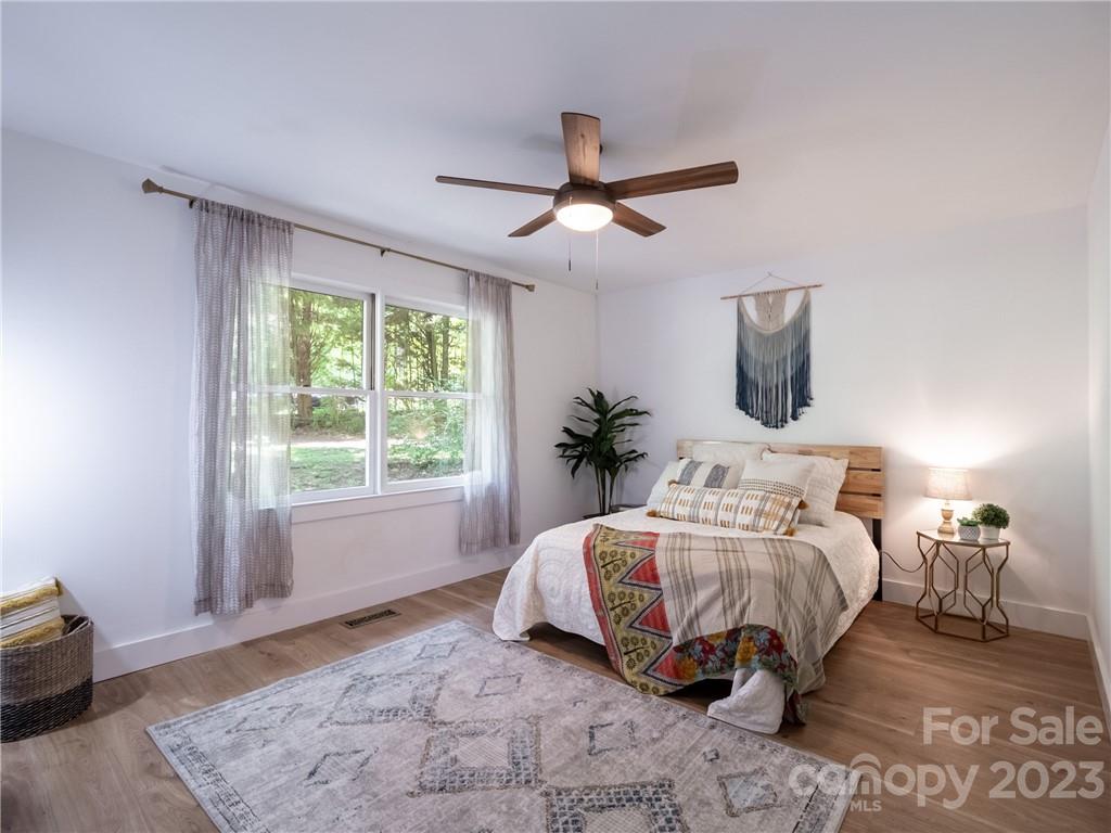 39 Cedar Mountain Road Asheville, NC 28803 - Photo 22 of 35 a bedroom with a bed and a window