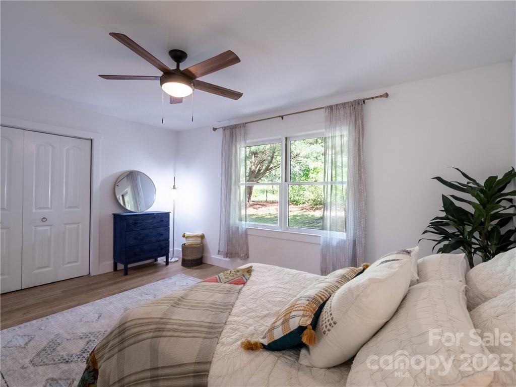 39 Cedar Mountain Road Asheville, NC 28803 - Photo 23 of 35 a bedroom with a bed and a window