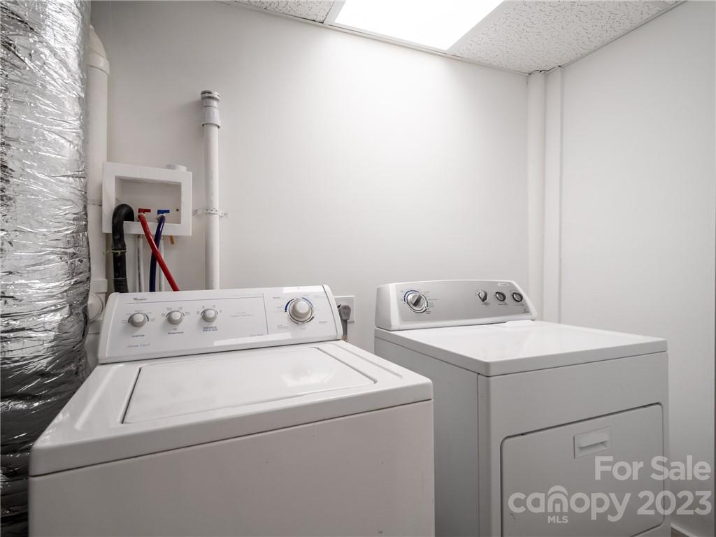 39 Cedar Mountain Road Asheville, NC 28803 - Photo 26 of 35 a utility room with dryer and washer