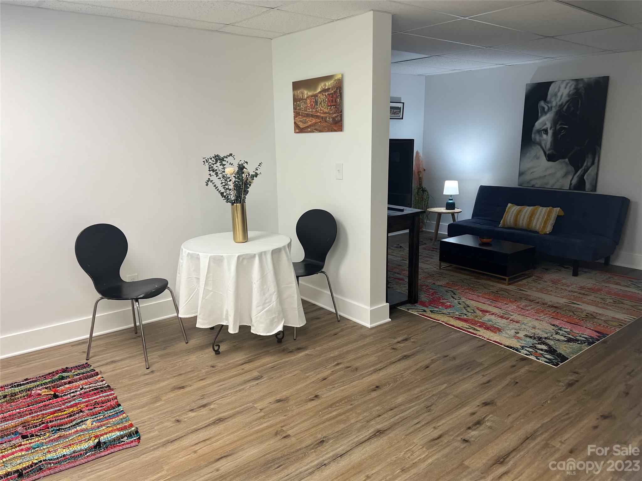 39 Cedar Mountain Road Asheville, NC 28803 - Photo 31 of 35 a living room with furniture and a mirror