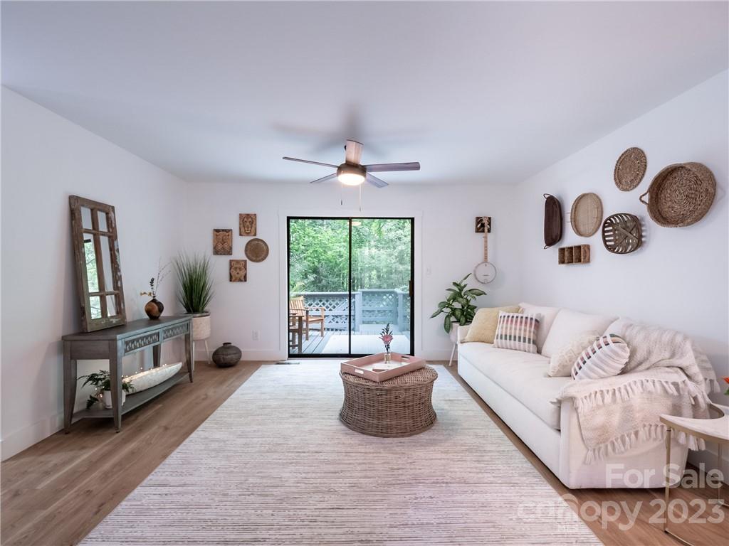 39 Cedar Mountain Road Asheville, NC 28803 - Photo 8 of 35 a living room with furniture and a large window