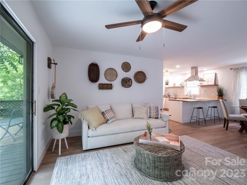 39 Cedar Mountain Road Asheville, NC 28803 - Photo 9 of 35 a living room with furniture and a large window