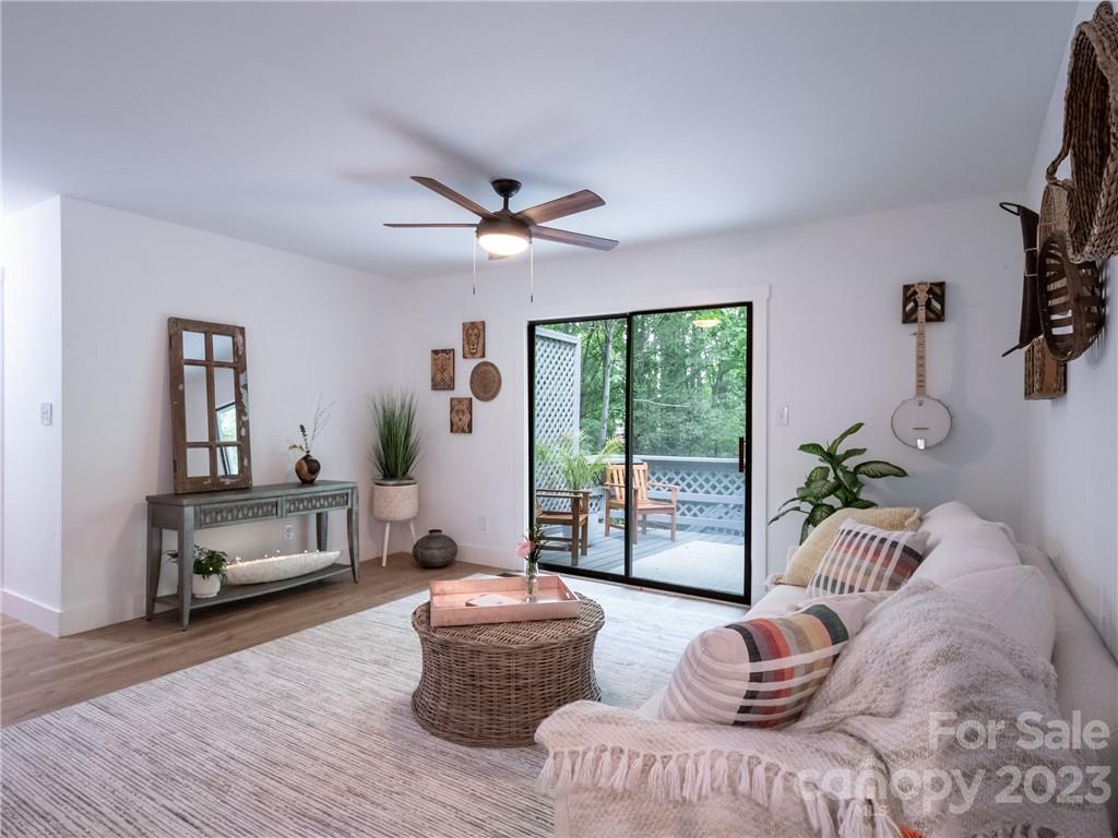 39 Cedar Mountain Road Asheville, NC 28803 - Photo 10 of 35 a living room with furniture and a large window