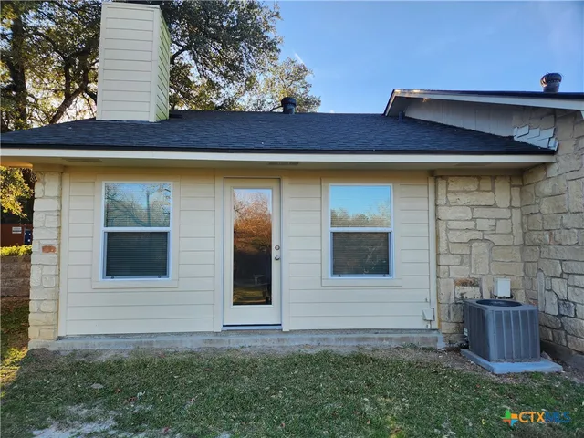 a front view of a house with garage