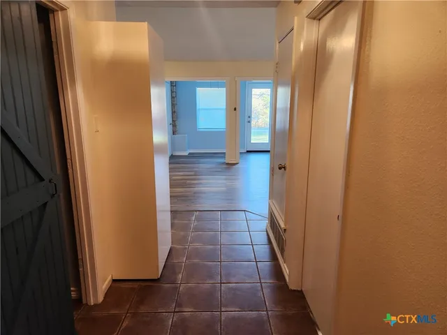 a bathroom with a glass door shower