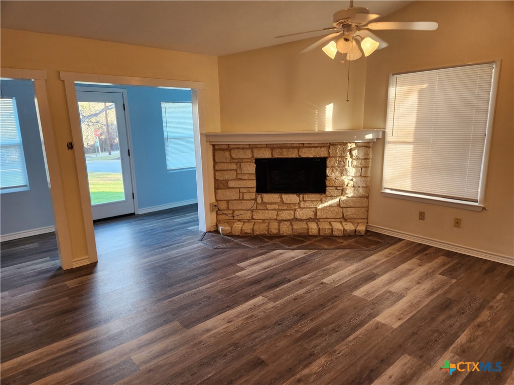 1015 Old Mill Road, Unit 4A Salado, TX 76571 - Photo 8 of 17 a living room with furniture and a fireplace