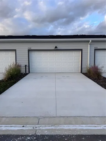 a view of empty room with stairs and bicycle