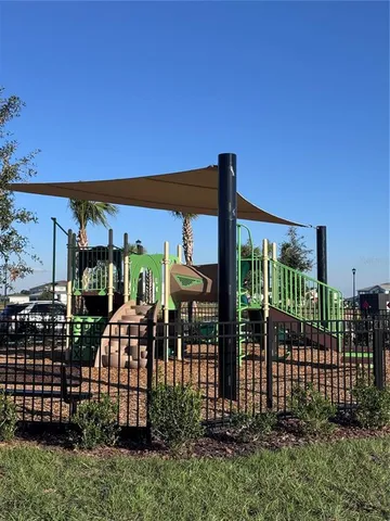 a view of a wrought iron fences in front of house