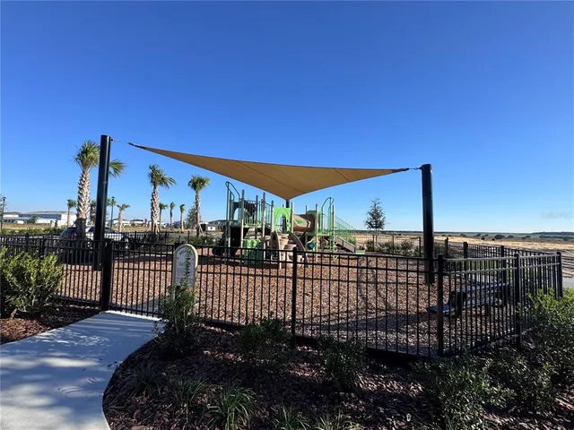 a view of a golf course with a lake view