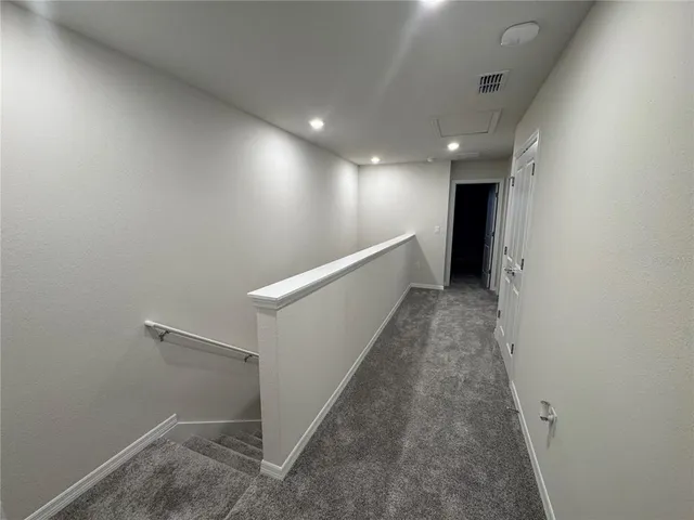 a view of hallway with stairs