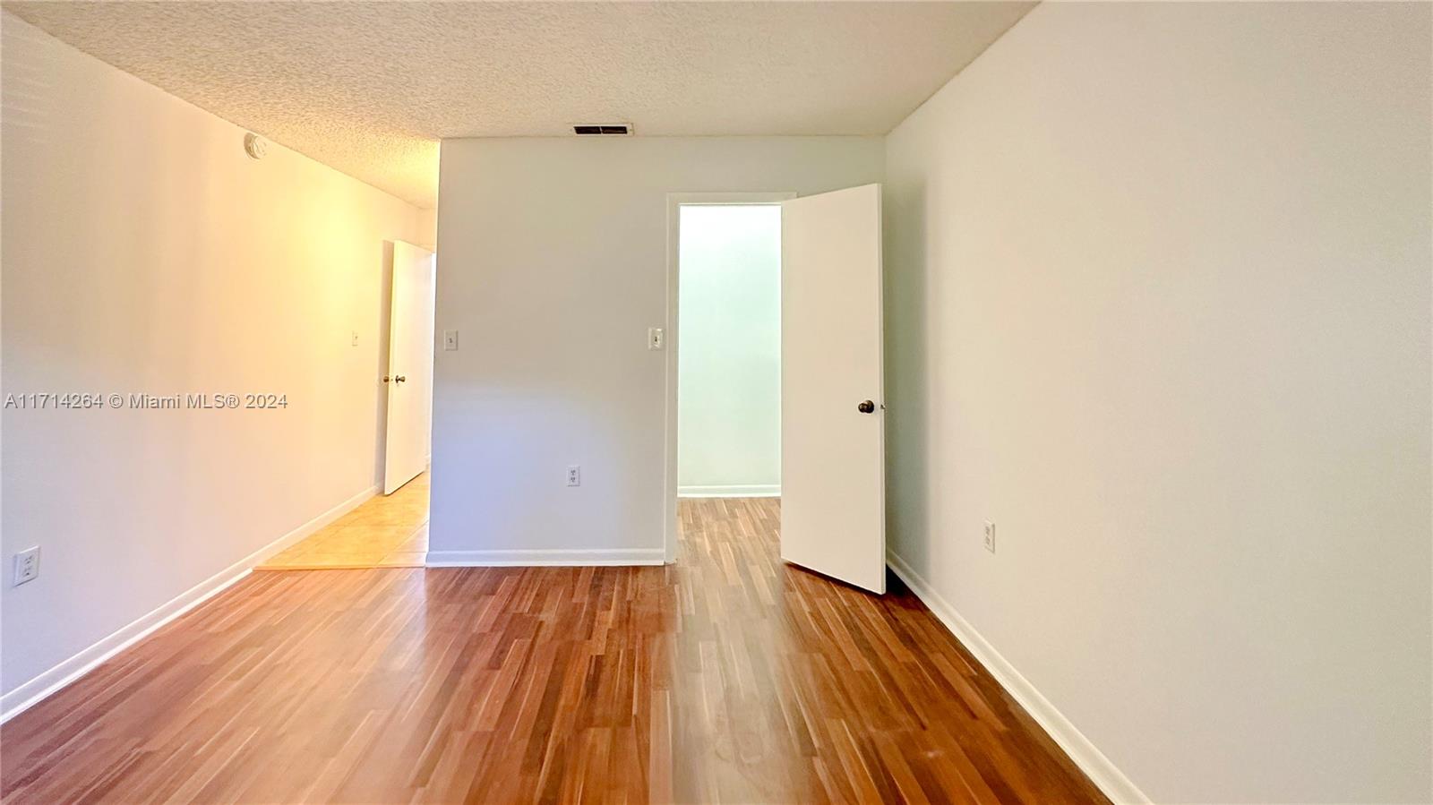 2218 Southwest 81st Avenue, Unit 2218 Miramar, FL 33025 - Photo 8 of 16 a view of a room with wooden floor