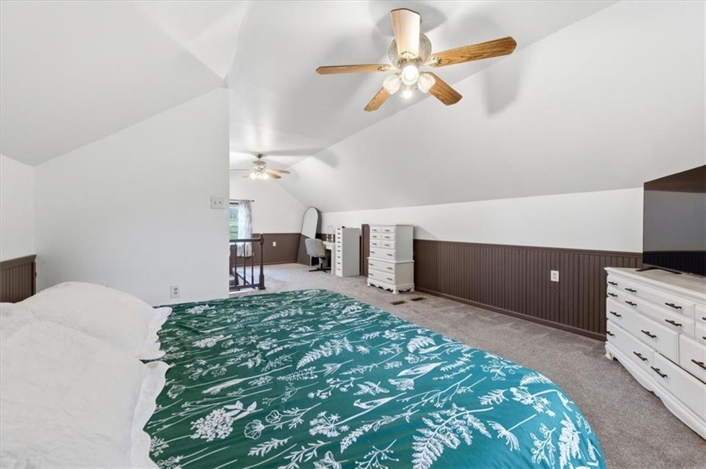 344 Winfield Road Cabot, PA 16023 - Photo 20 of 30 a bedroom with a bed and a chandelier